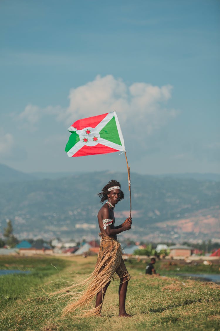 Man Holding A Flag Of Burundi 