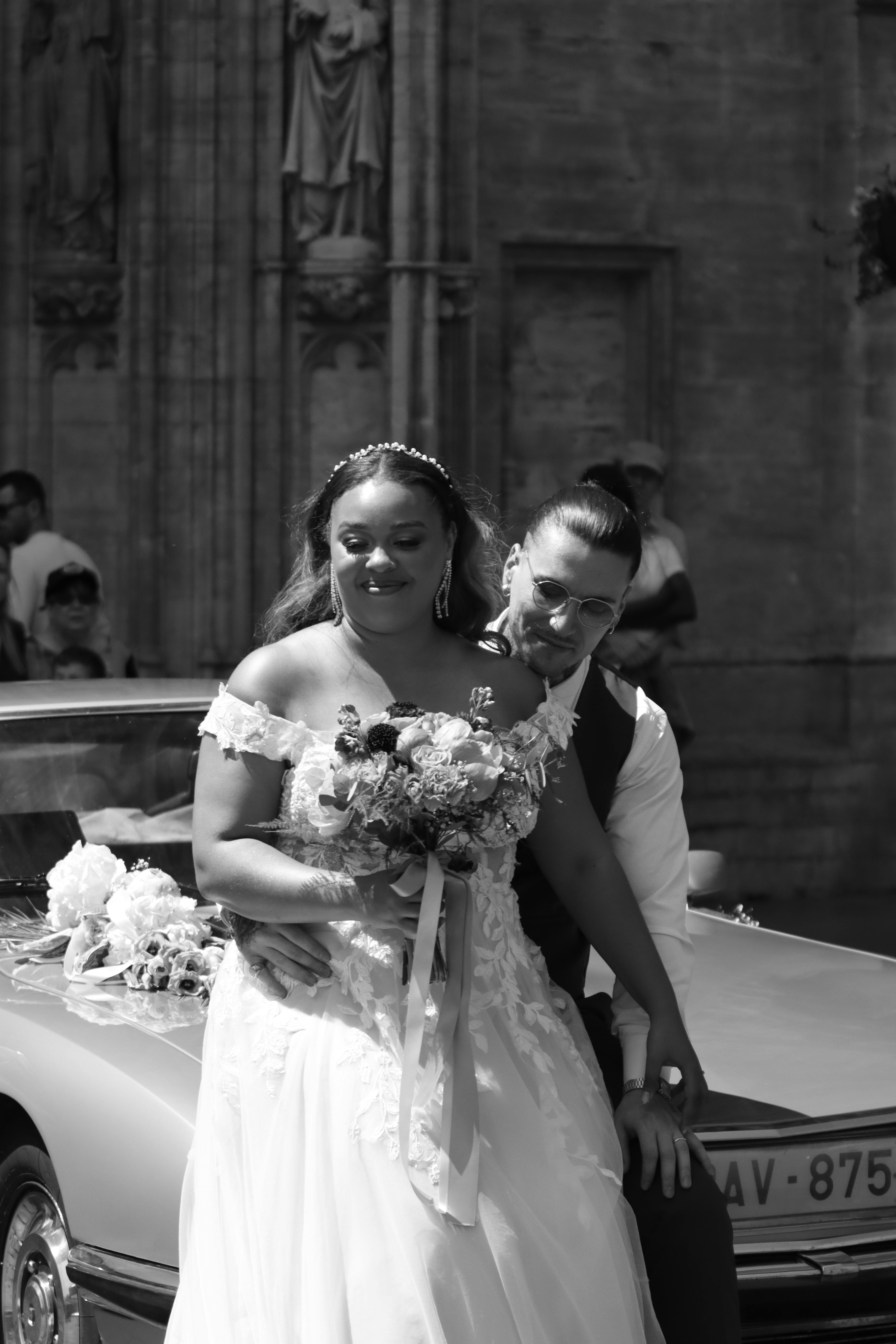 A black and white portrait of a bride and groom outside a church in Brussels, Belgium.