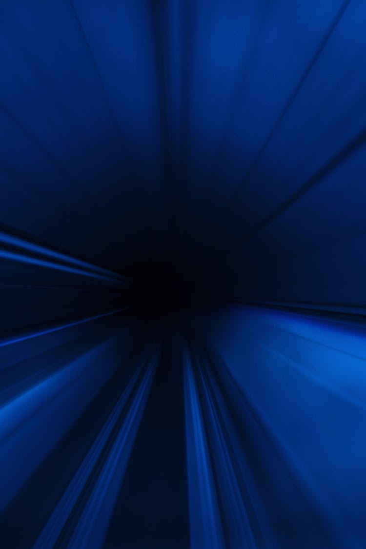 Abstract Rays Of Blue Light Background 