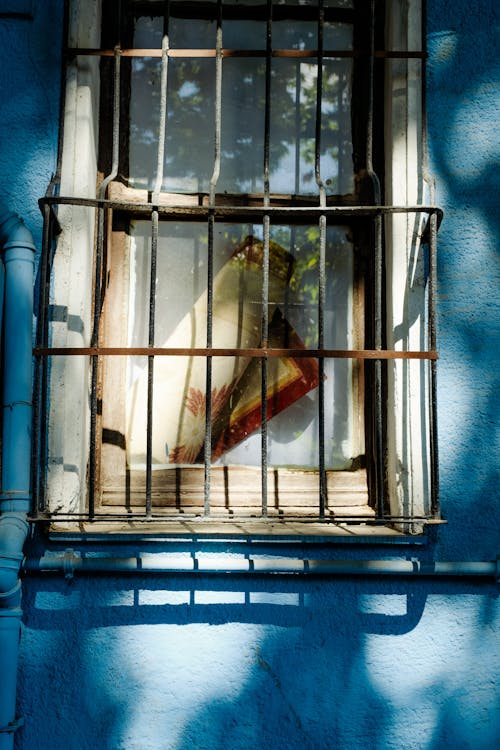 A Rusty Window Grill Photo