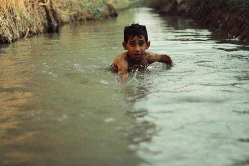 Kid in River