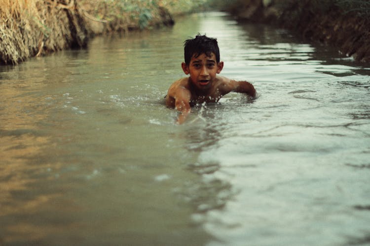 Kid In River