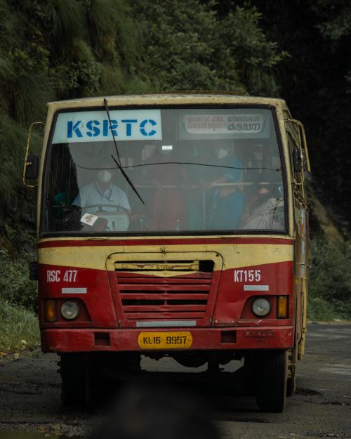 Free Front view of a KSRTC bus on a scenic mountain road, Kerala, India. Stock Photo