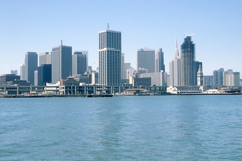 Free City Buildings Near Body of Water Stock Photo