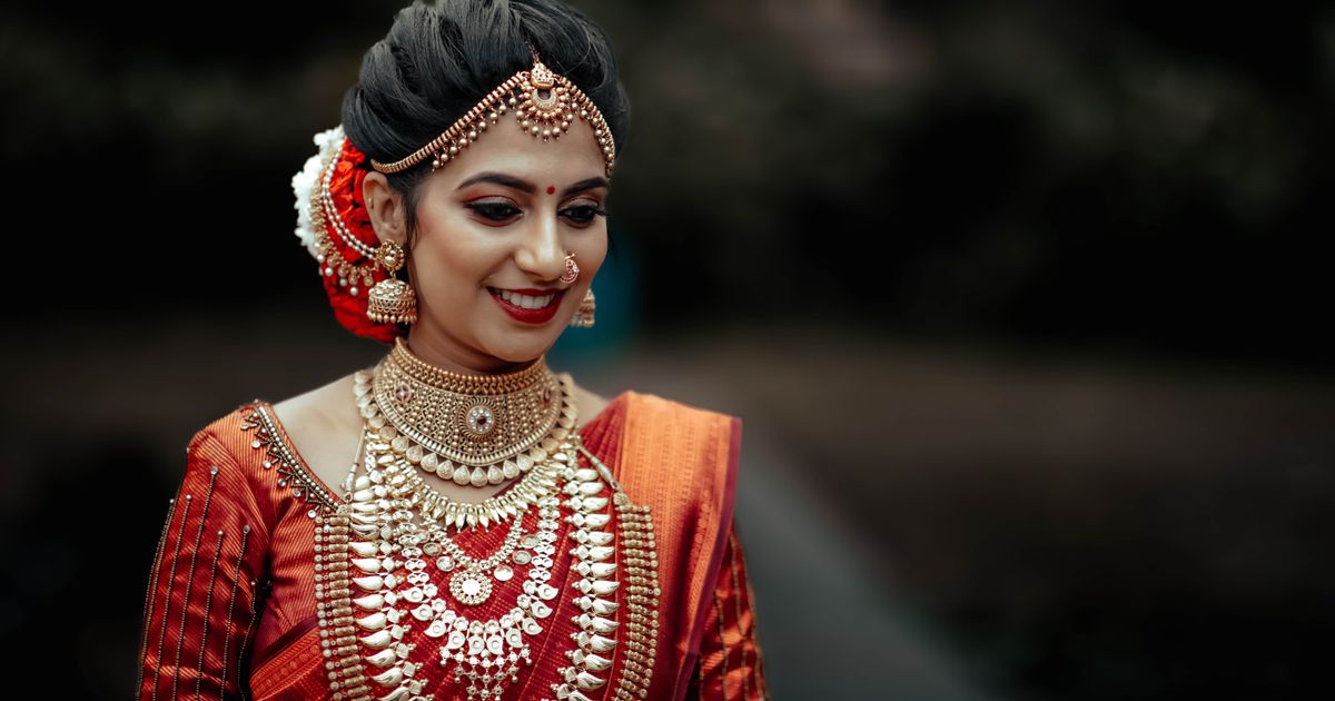 Bride in a traditional silk sari and gold jewellery (Marriage Hall Catering in Vellore)
