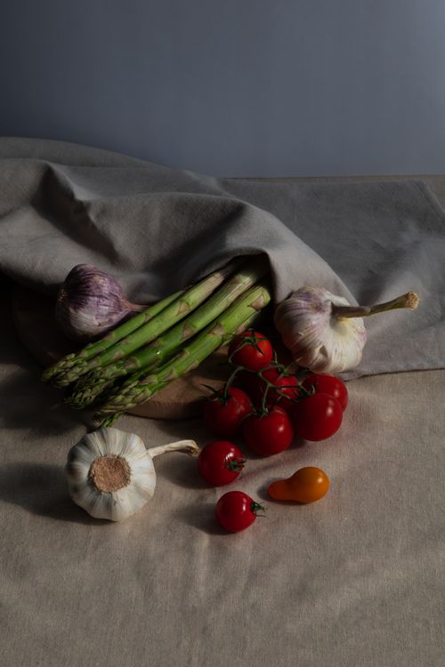 A still life of garlic, beans and tomatoes — photo by Iryna Riabchykova on Pexels