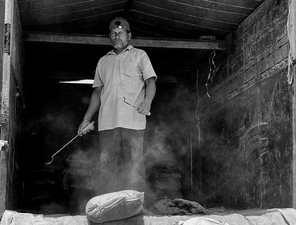 Worker in durable work trousers in a warehouse environment