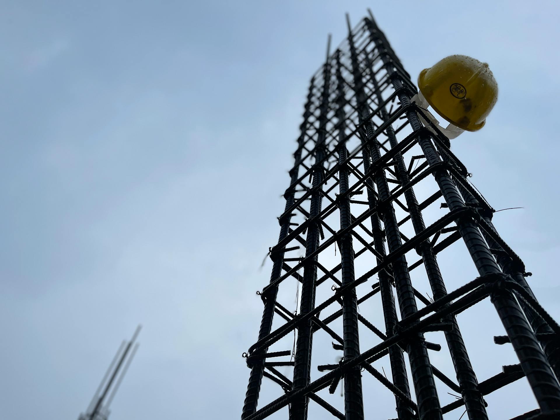 Safety Helmet Hanging on Metal Reinforcement