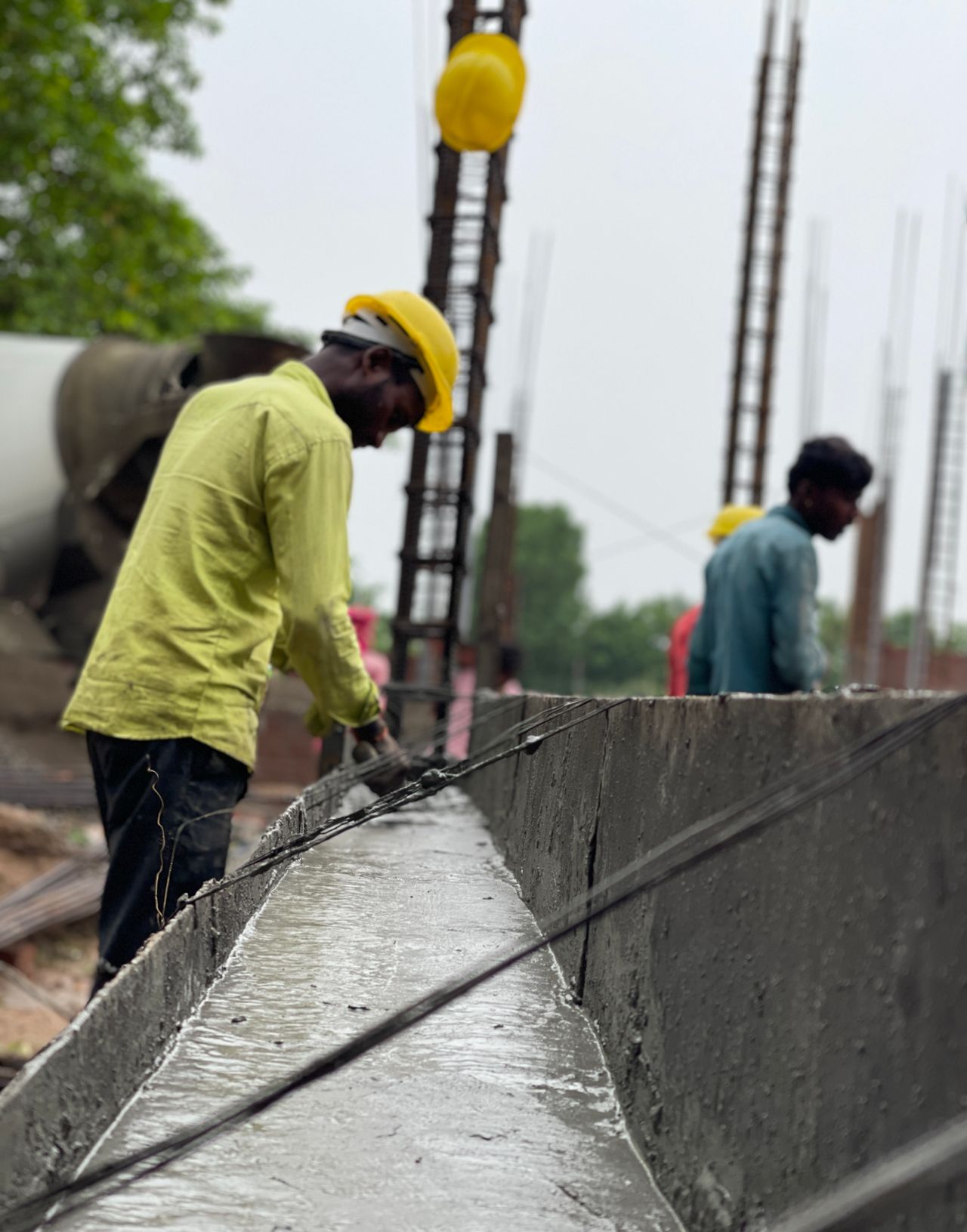 Workers building a poured concrete foundation