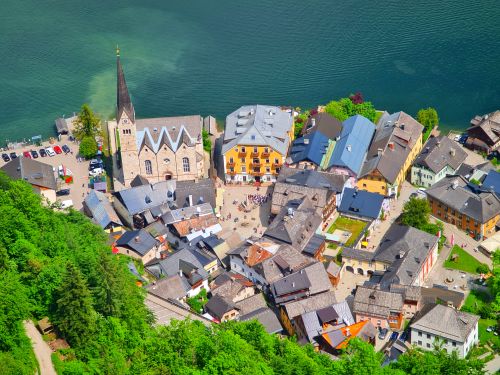 Free Scenic aerial view of Hallstatt, Austria with iconic lake and historic Lutheran church. Stock Photo