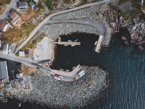 Boats Docked near on Rocky Shore