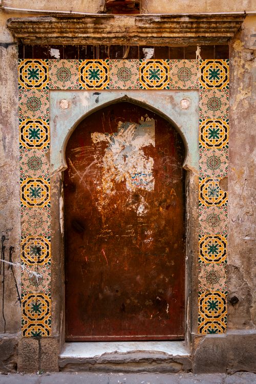 Free Explore a beautifully decorated ancient doorway with detailed tile work in Algiers, Algeria. Stock Photo