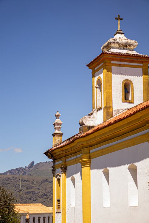 Free A stunning view of Baroque church architecture in Ouro Preto, Brazil, under a clear sky. Stock Photo