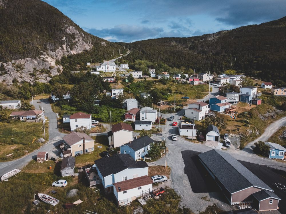 Aerial Photography of Houses near Mountains · Free Stock Photo
