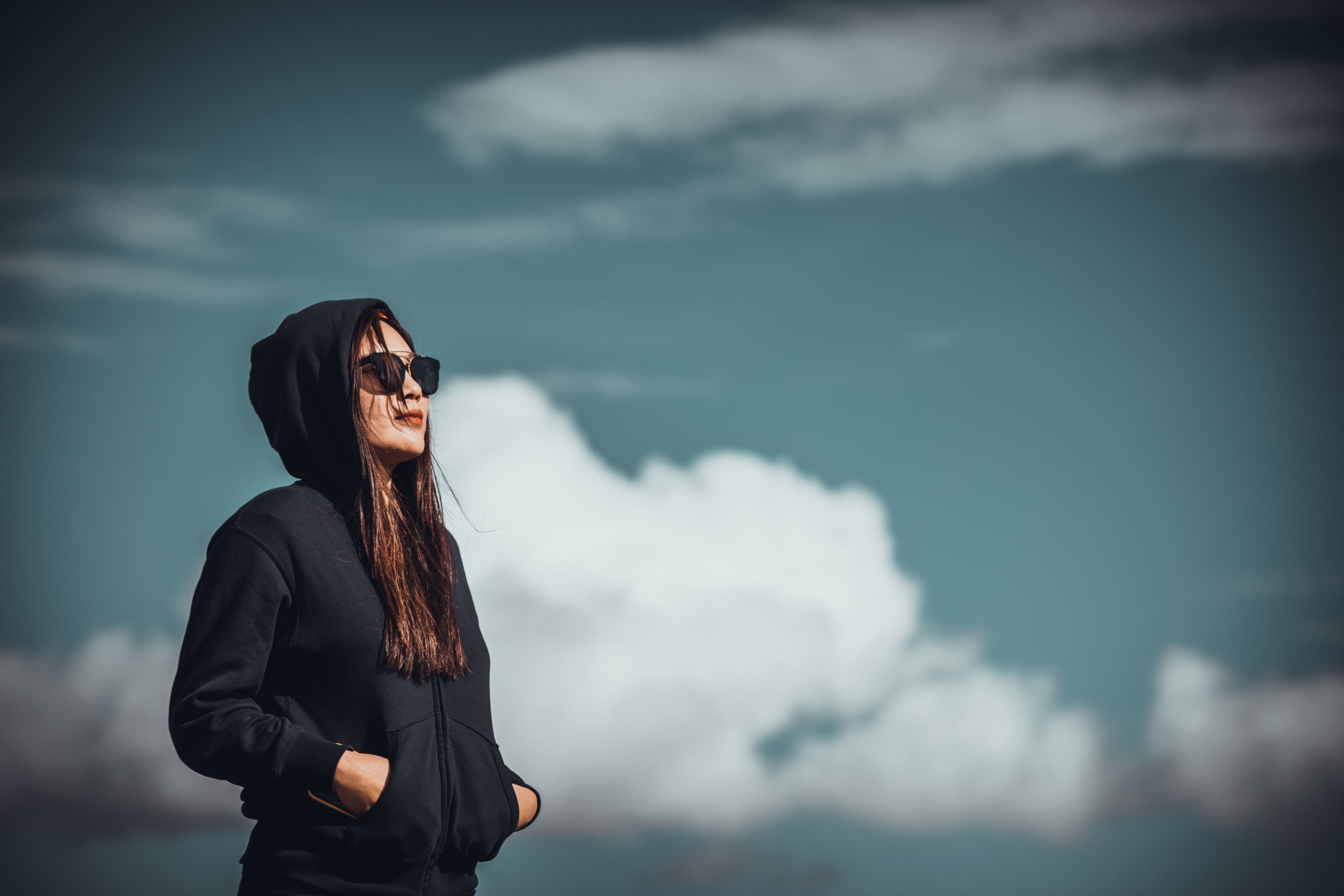 Woman in Black Hoodie Jacket Wearing Sunglasses · Free Stock Photo