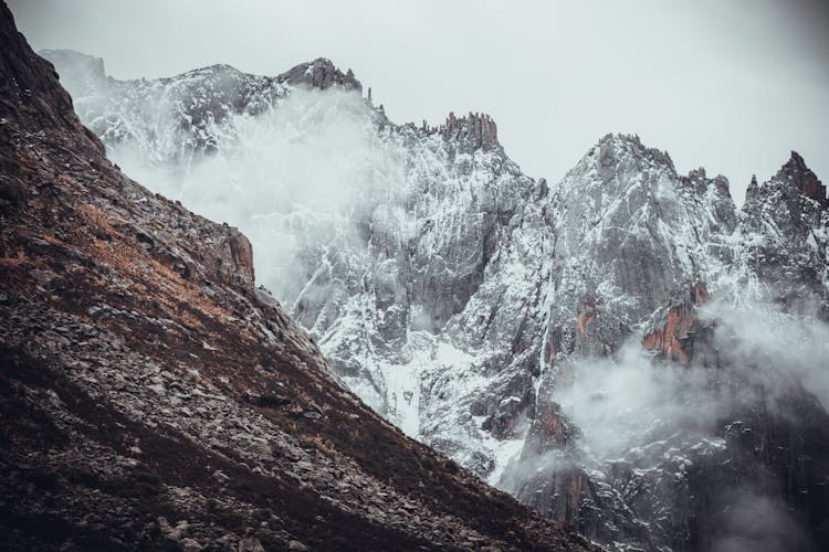 Mountains Peaks In Snow And Fog