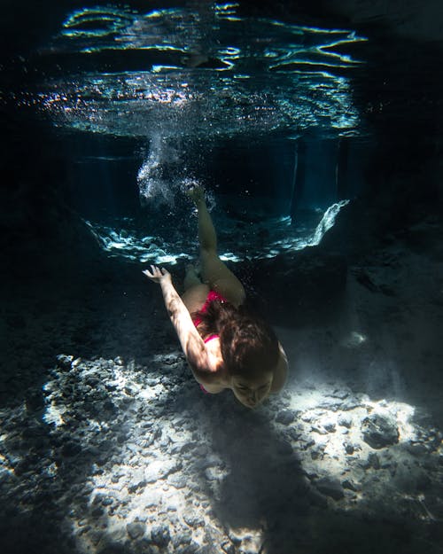 Free Underwater Shot of Woman Diving Stock Photo