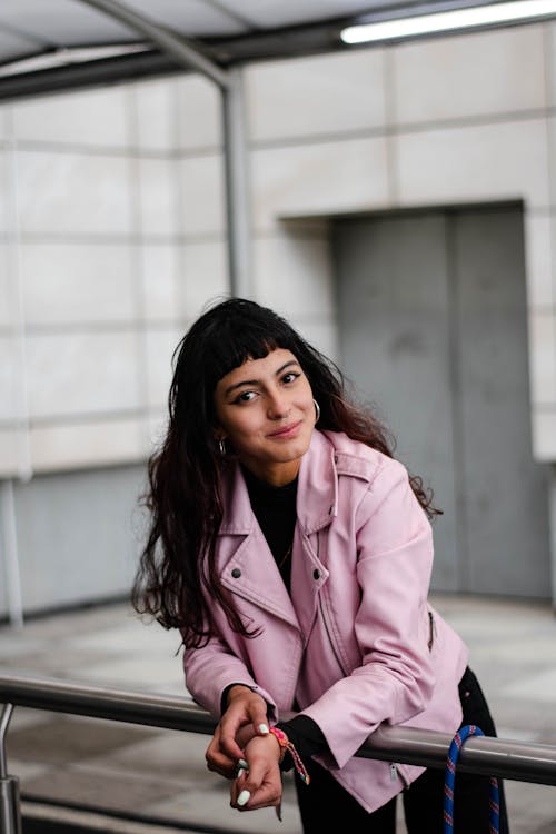 Outdoor Urban Portrait of a Woman in a Pink Leather Jacket