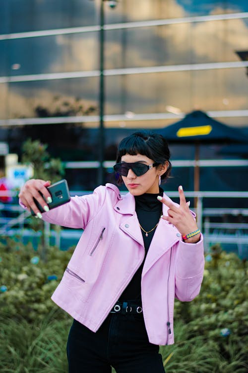 Gesturing Woman Taking Selfie