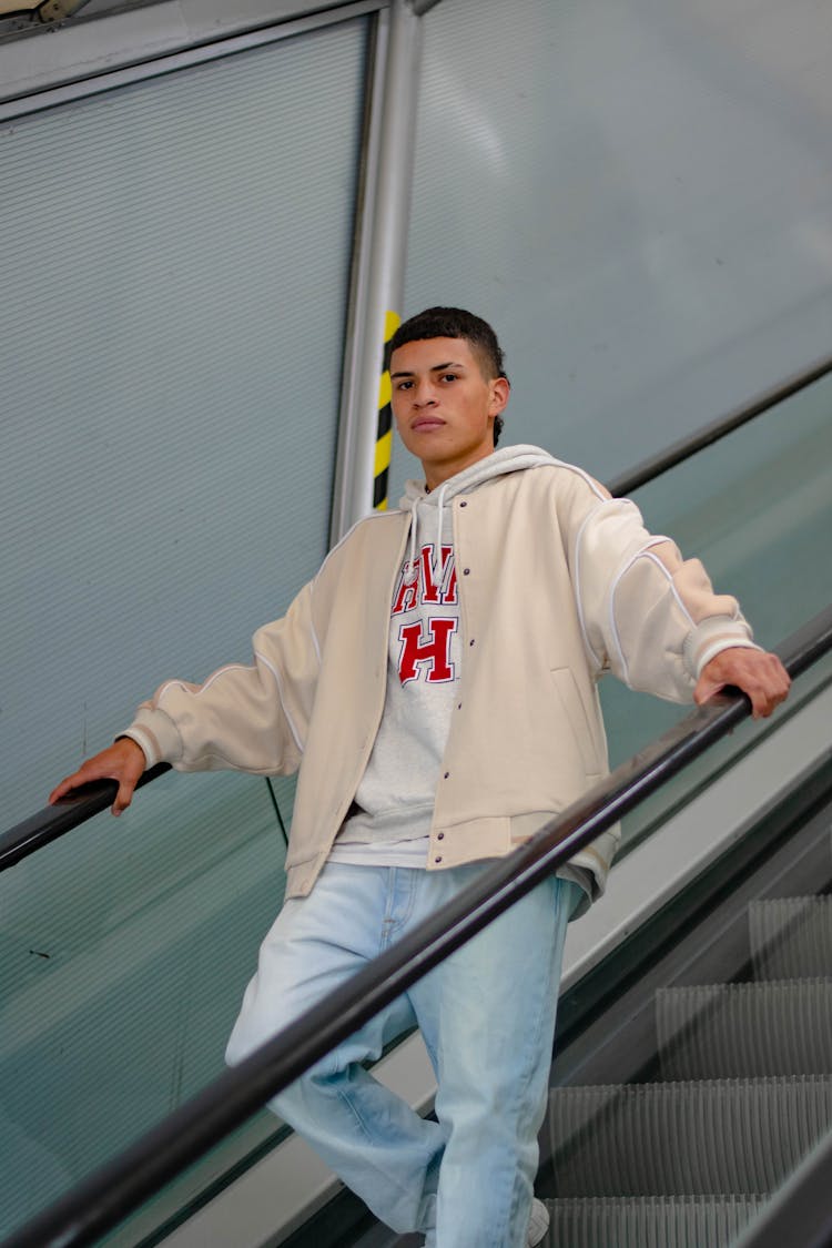 Young Fashionable Man On An Escalator 