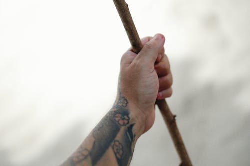 A Person Holding a Stick