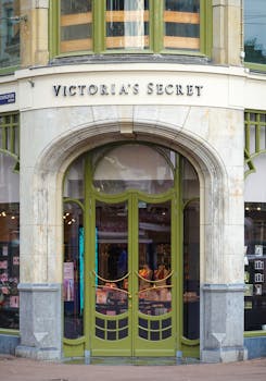 Charming entrance of a Victoria's Secret store with art deco elements.