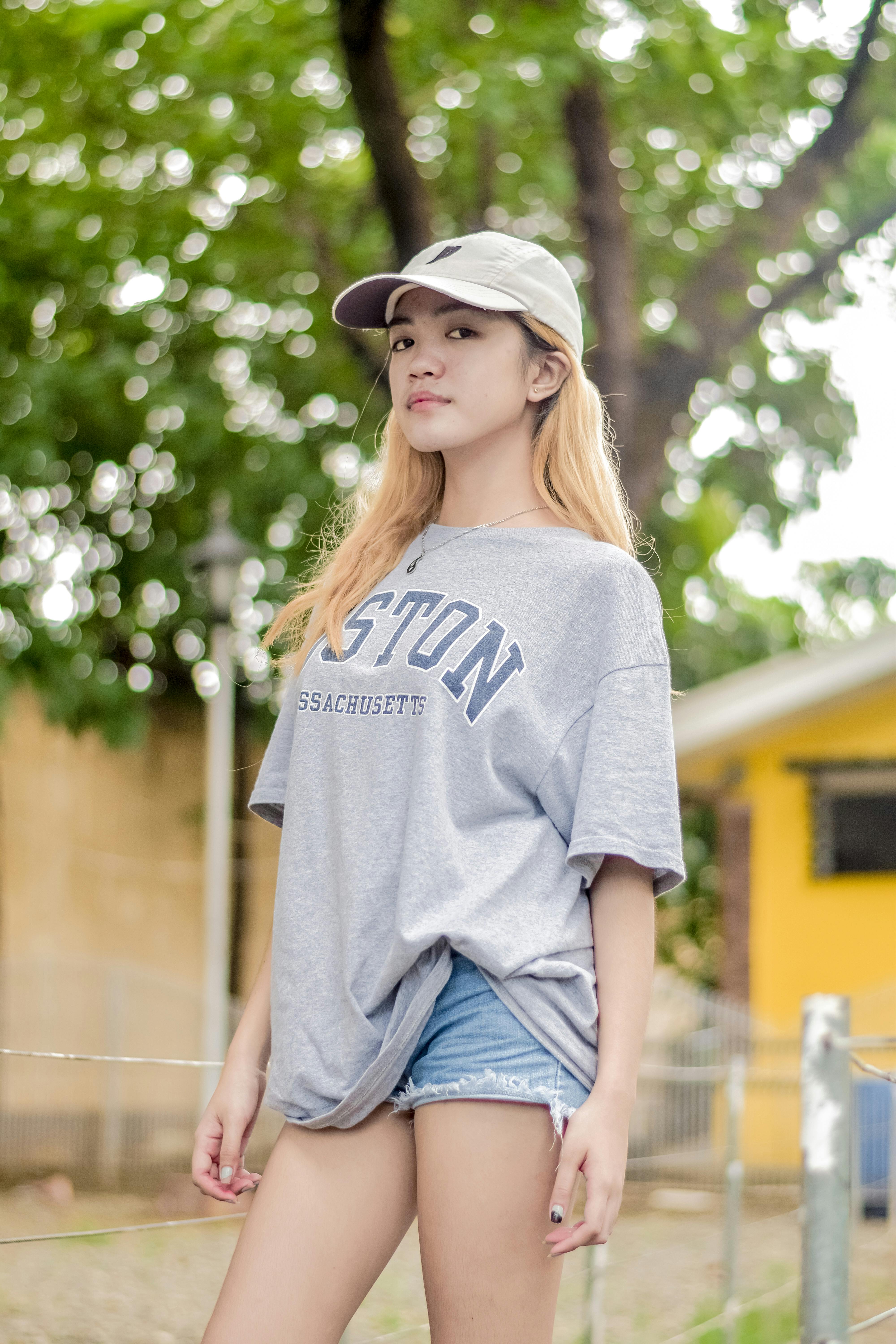 CloseUp Shot of a Woman in Gray Shirt and Denim Shorts · Free Stock Photo