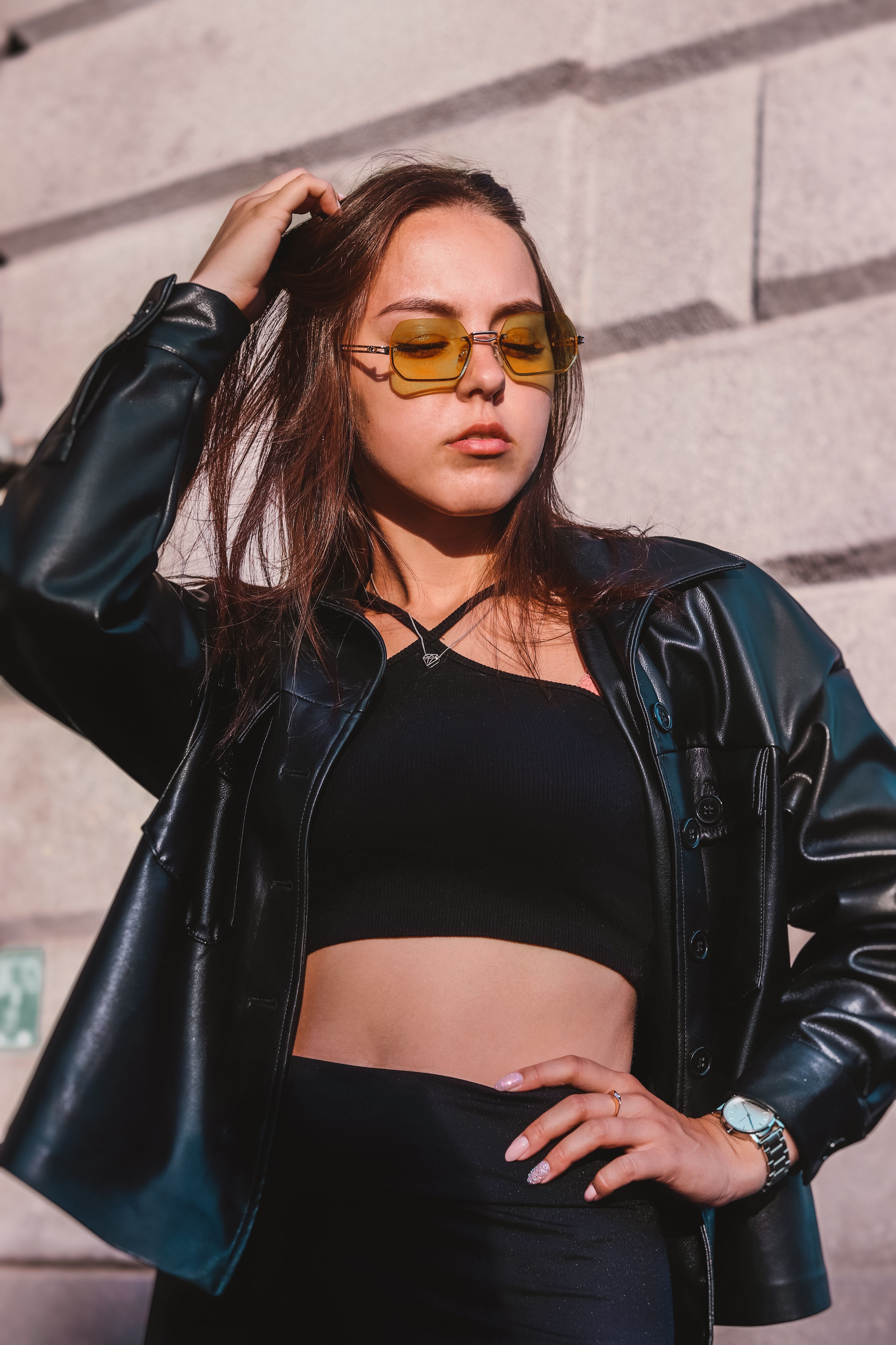 Close-Up Shot of a Woman in Black Leather Jacket and Sunglasses · Free ...