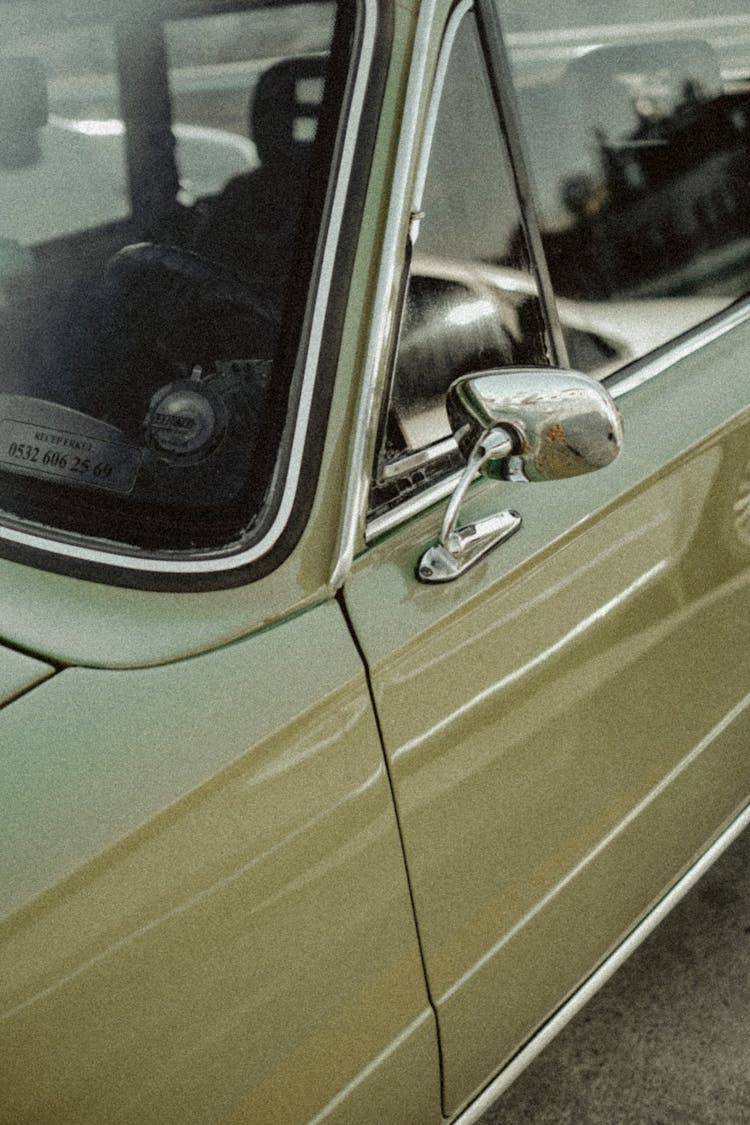 Green Car With Silver Side Mirror