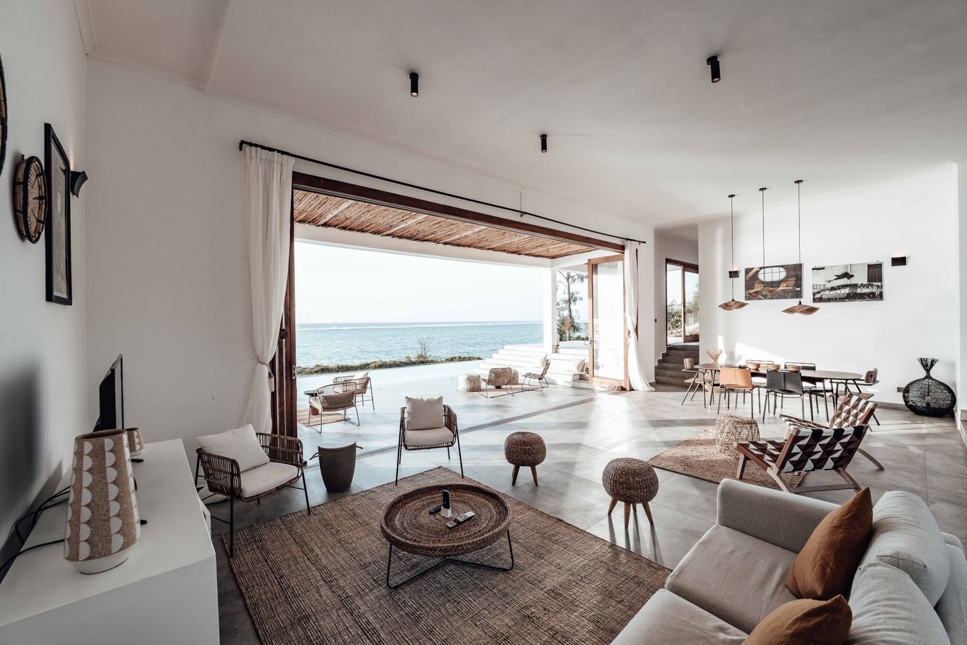 Interior of a private residence with a large window facing the sea