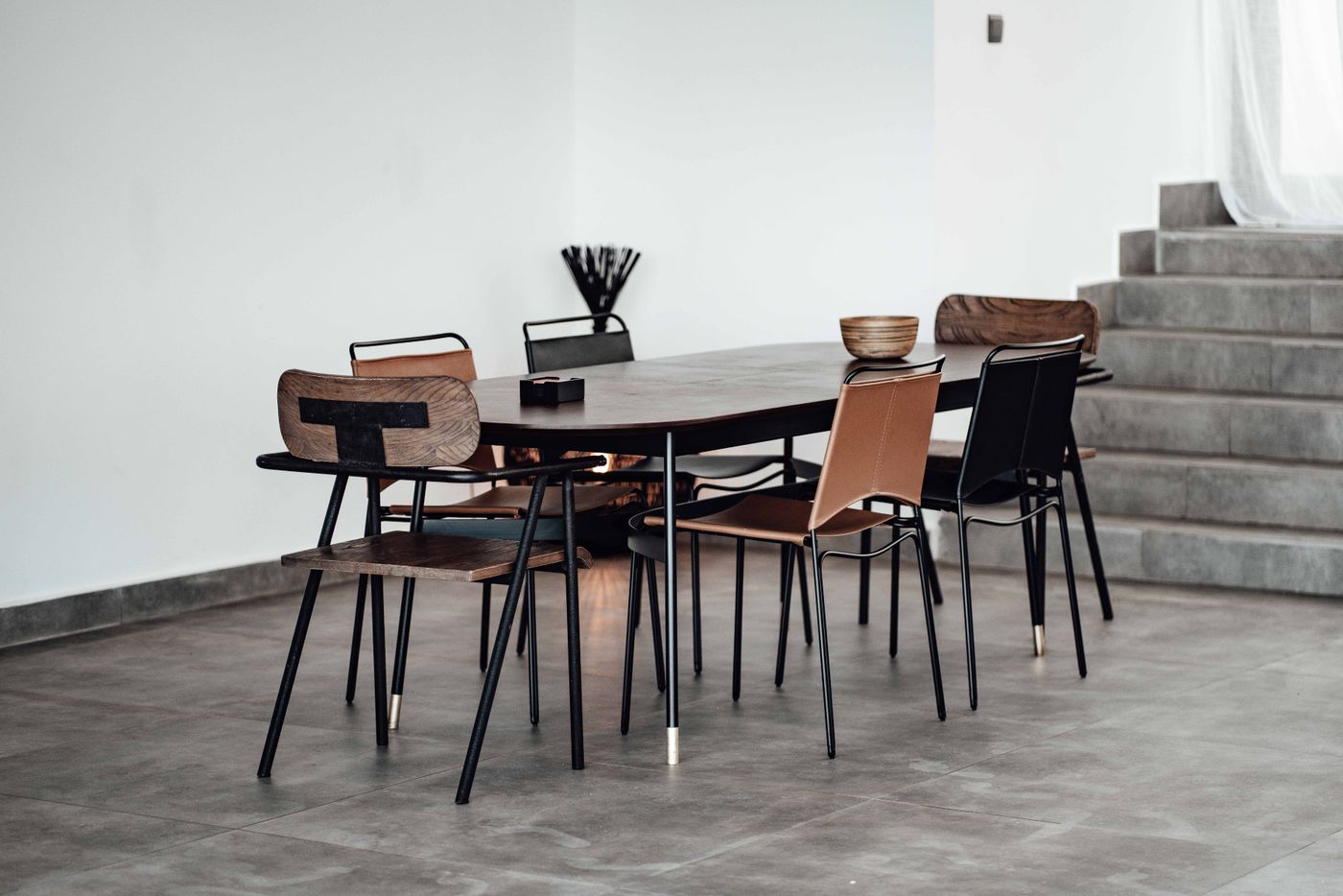 Modern dining room interior with dining table and stylish chairs