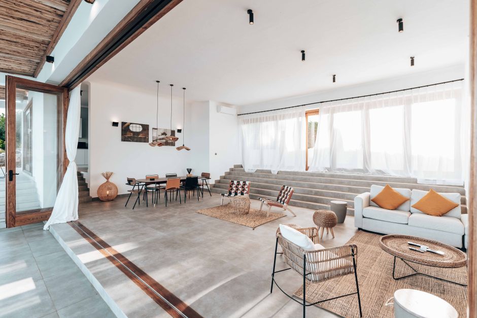 Photo by Keegan Checks on Pexels Spacious modern living room featuring open plan design with ample natural light.
