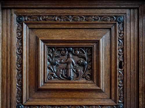 Free Close-up of an intricately carved antique wooden panel with detailed craftsmanship and vintage appeal. Stock Photo