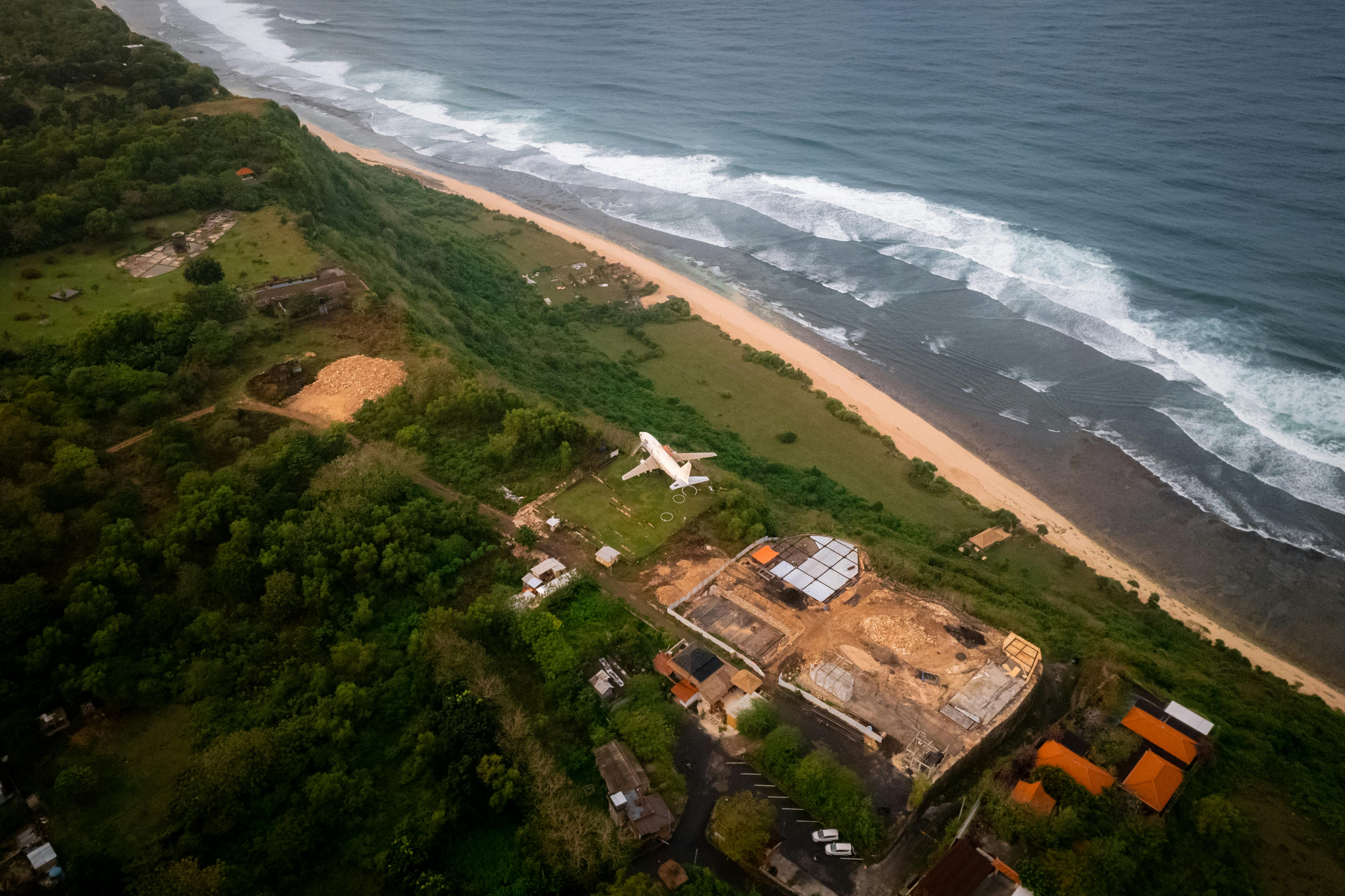 aerial view of construction site by sea shore