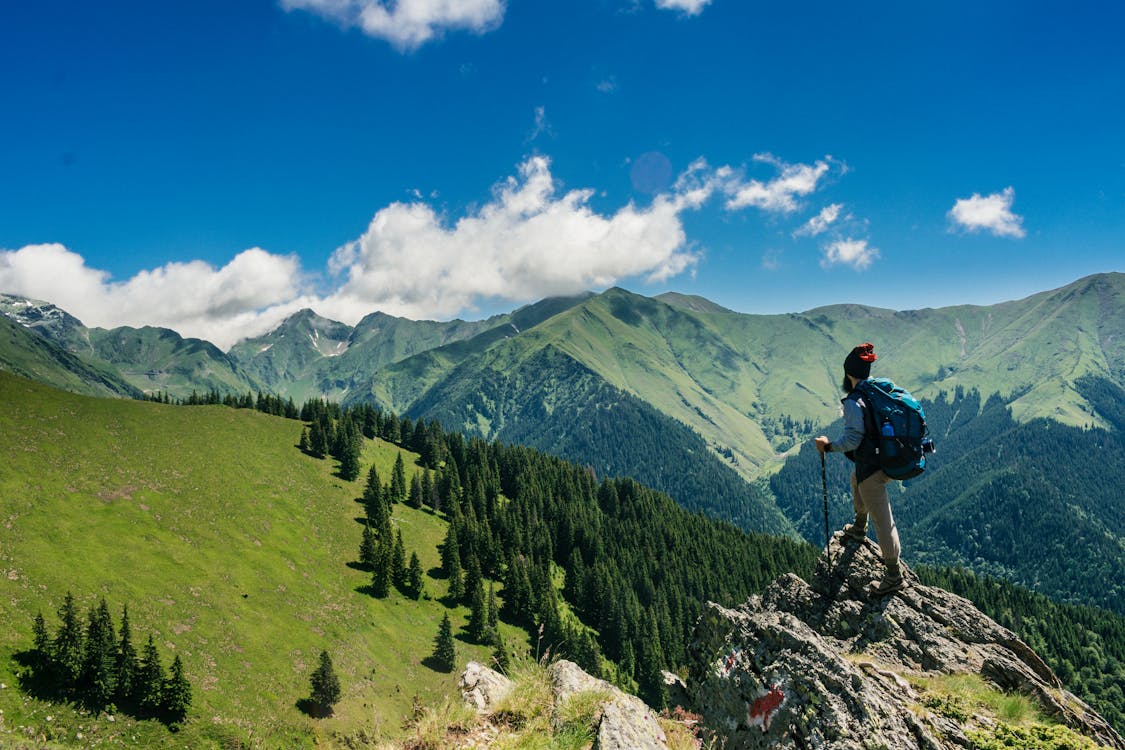 Free Man Standing on a Rock Stock Photo