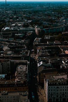 Aerial shot showcasing Berlin's dense urban landscape bathed in daylight.