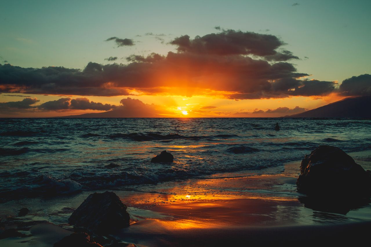 capture of a breathtaking sunset over the kula coastline with vibrant