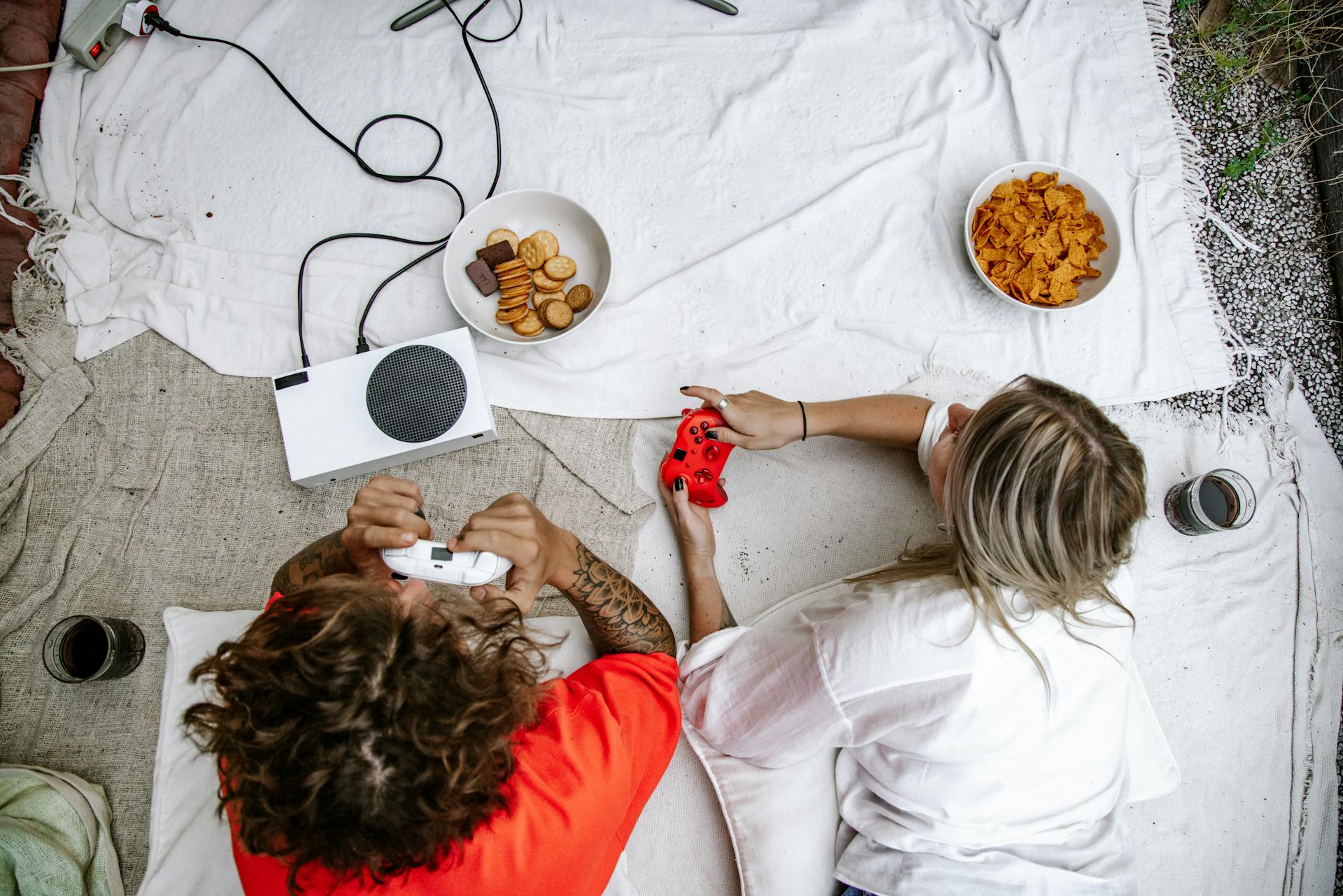 Top View of a Couple Playing on a Game Console Together