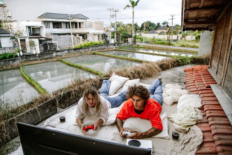 A Man And Woman Playing Video Games