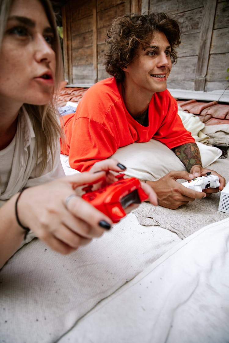 A Man And Woman Playing Video Games