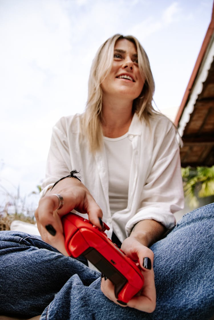 A Woman Playing A Video Game