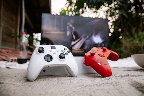 A Photo of Red and White Wireless Game Controllers