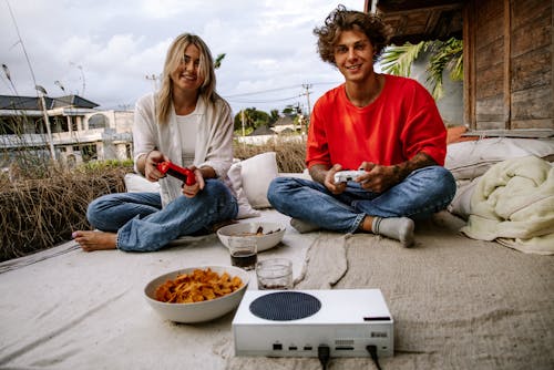 A Couple Playing on a Game Console Together