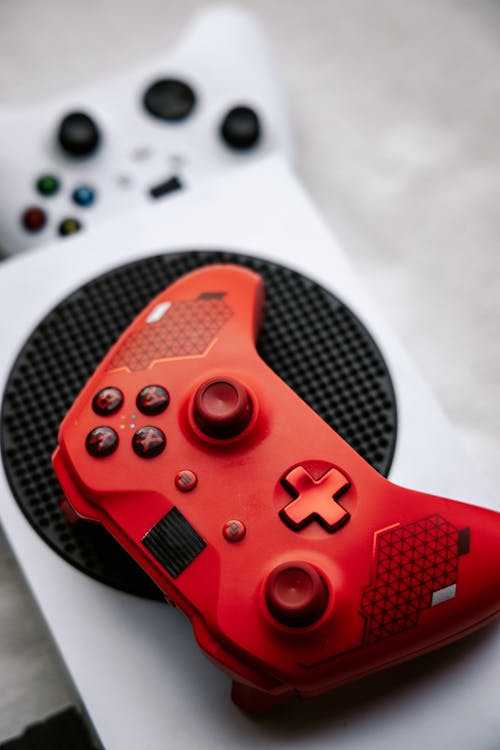 A Photo of a Red Wireless Game Controller