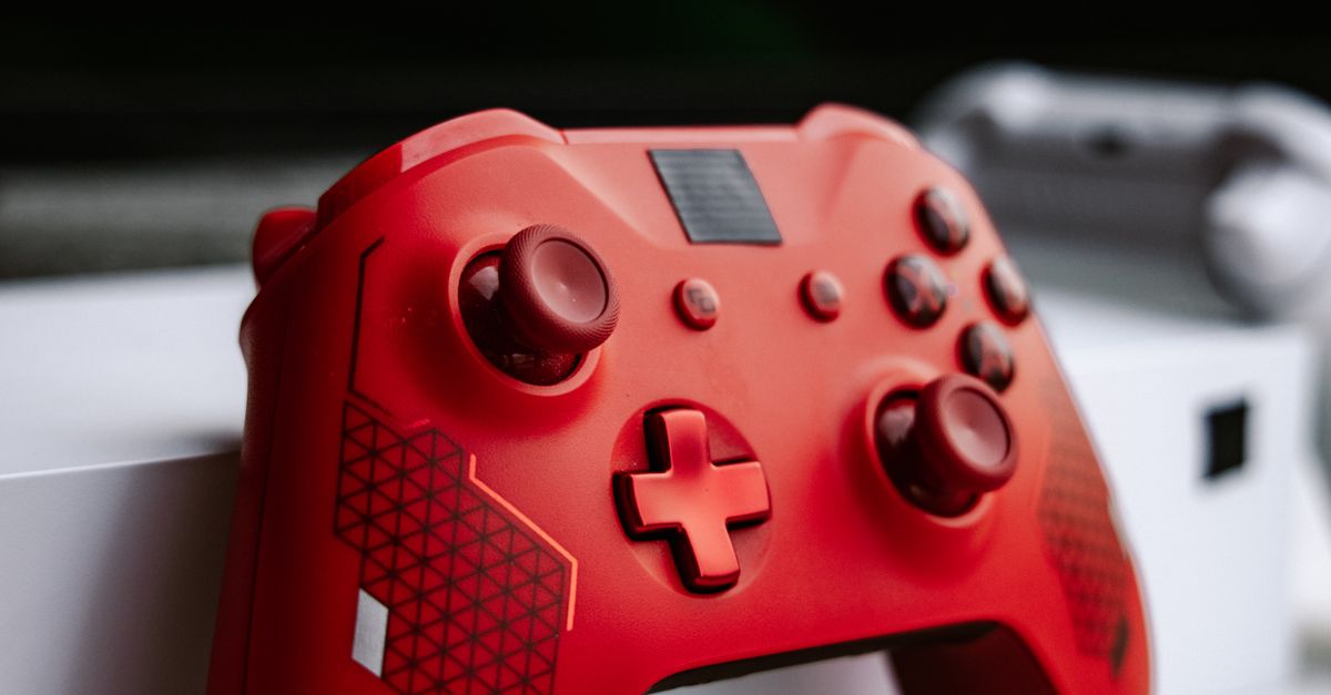 Red Game Controller Robe Close-up of a Red Game Controller · Free Stock Photo