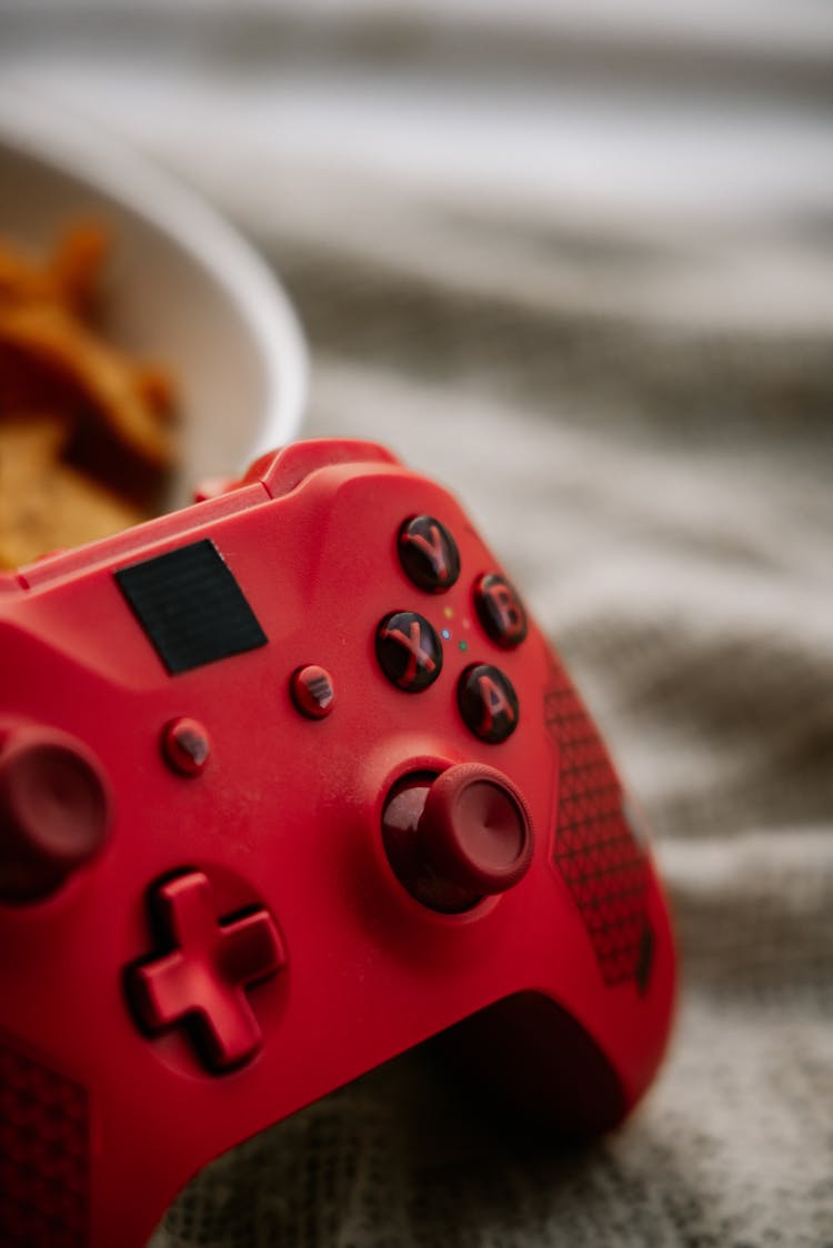 A Close-up Photo Of Red Xbox Wireless Controller