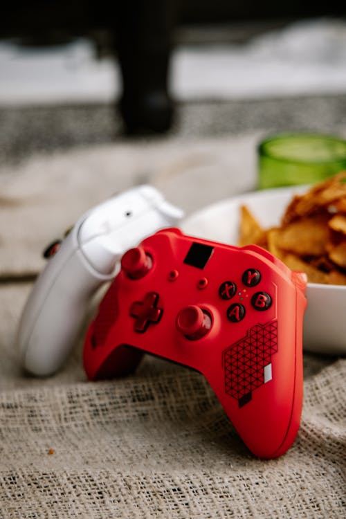 A Photo of Red and White Xbox Wireless Controllers