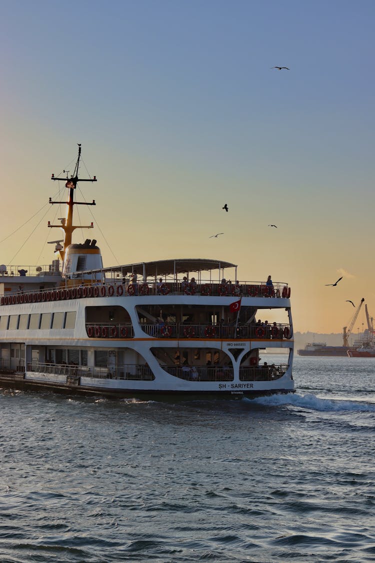 A White Ferry Sailing On The Sea