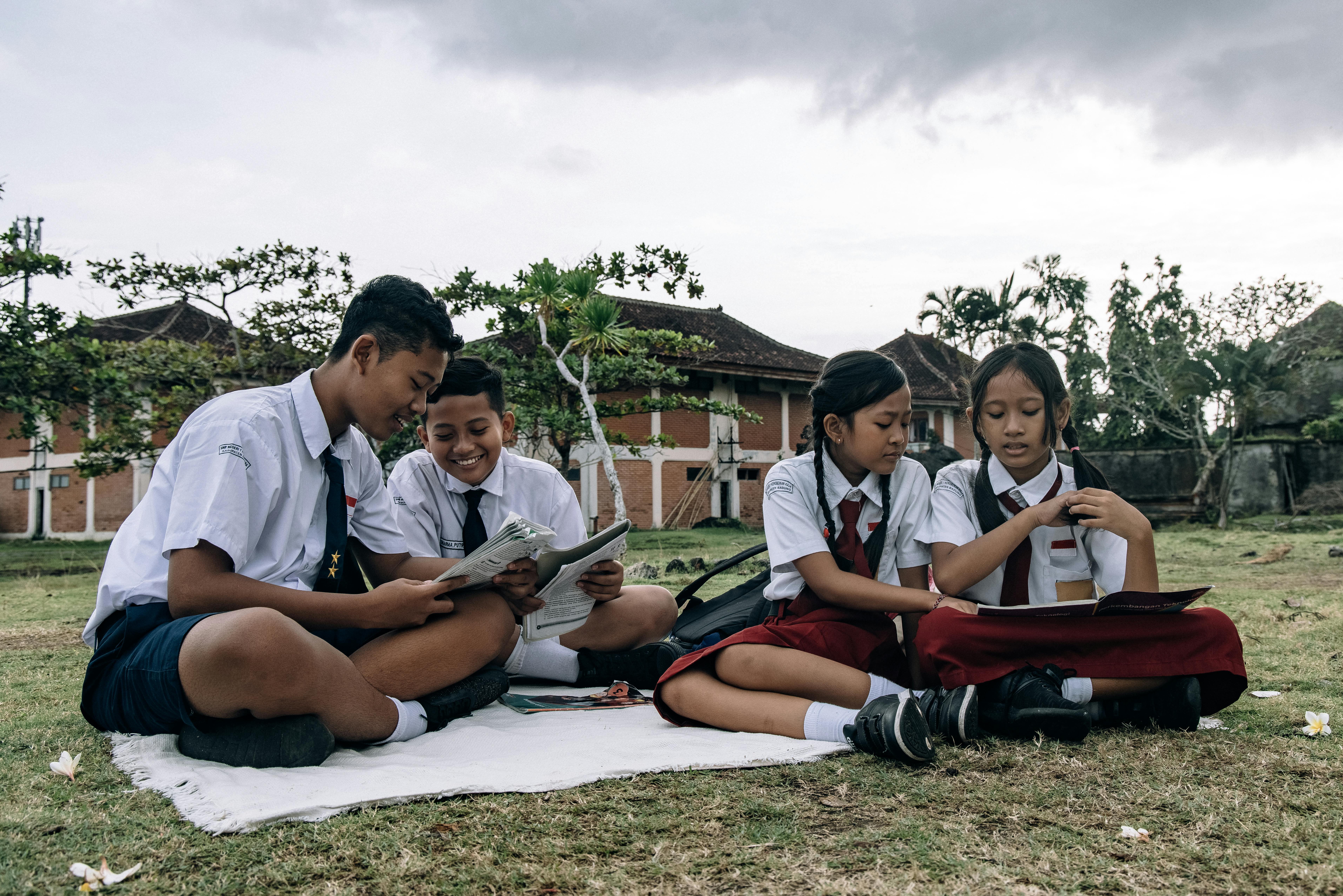 boys and girls in school uniforms at picnic