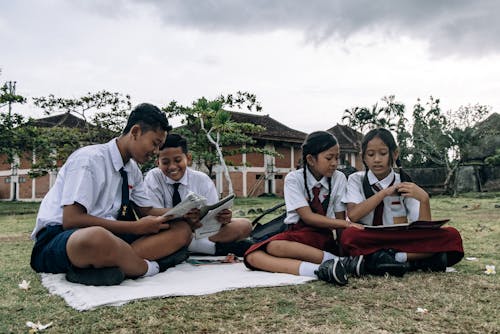 Boys and Girls in School Uniforms at Picnic